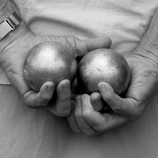 A Player Holding Two Boules